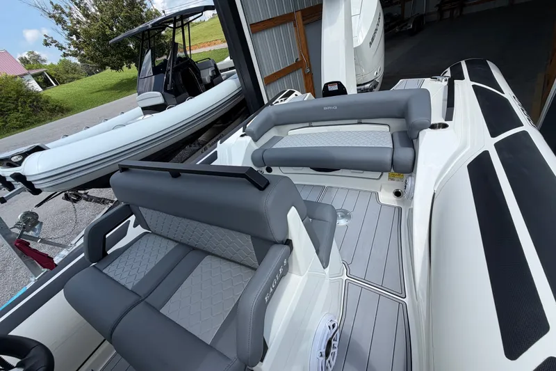 Slide: The Image of 2027 Brig Eagle 8 boat interior with gray seating and modern design. - 28