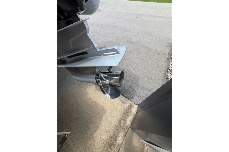 Slide: The Image of 2027 Brig Eagle 8 boat propeller and outboard motor detail on pavement. - 36