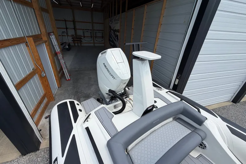 Slide: The Image of 2027 Brig Eagle 8 boat with Mercury engine in a storage garage. - 33