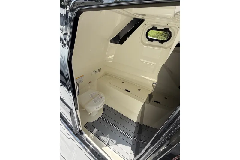 Slide: The Image of Interior cabin of 2027 Brig Eagle 8 boat, featuring sleek design and compact amenities. - 17
