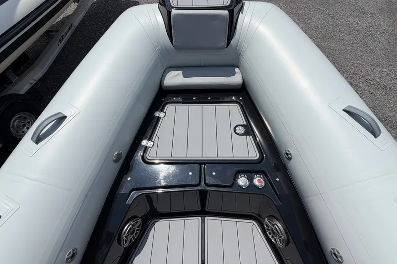 Slide: The Image of 2027 Brig Eagle 8 inflatable boat interior with sleek seating and storage compartments. - 19
