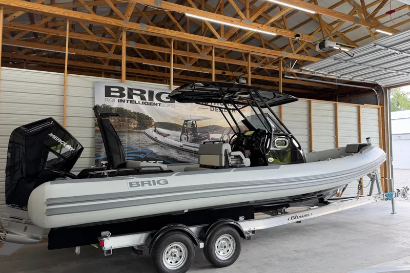 Slide: The Image of 2027 Brig Eagle 8 boat on trailer in a garage setting. - 29