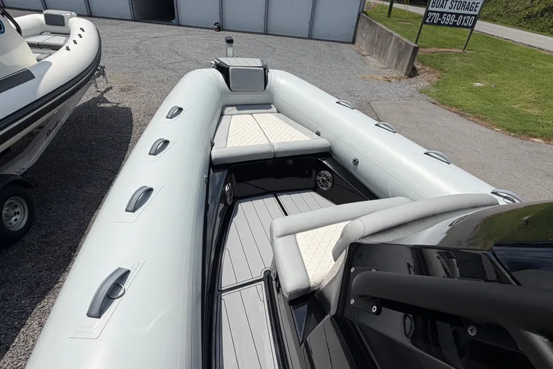Slide: The Image of 2027 Brig Eagle 8 inflatable boat with cushioned seating and sleek design. - 18