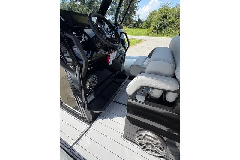 Slide: The Image of Interior of 2027 Brig Eagle 8 boat with steering wheel and seating. - 16