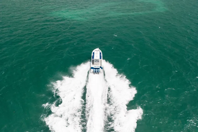 Slide: The Image of Aerial view of 2026 Formula 387 Center Console Fish boat cruising on open water. - 13