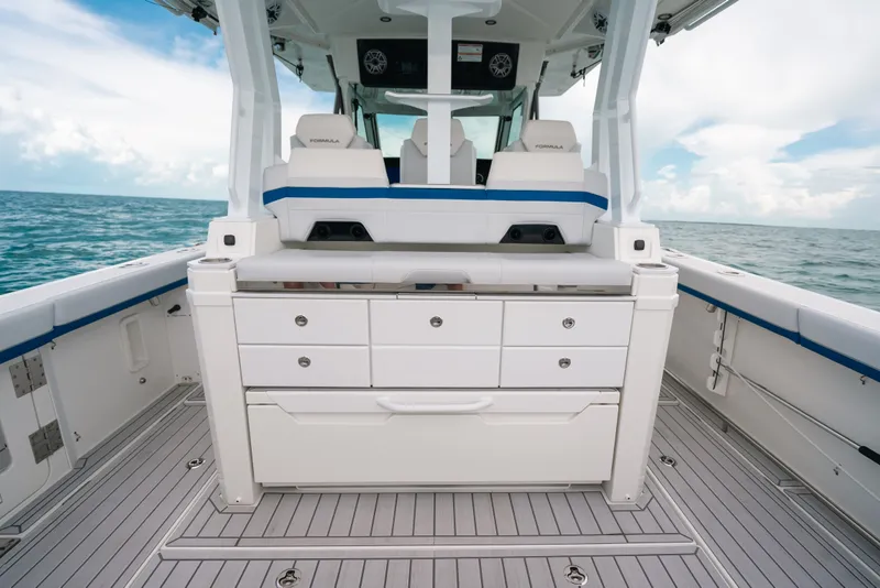 Slide: The Image of 2026 Formula 387 Center Console Fish boat interior with storage drawers, ocean view. - 41