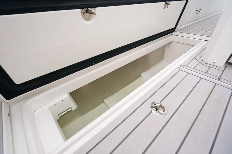 Slide: The Image of Open storage compartment on 2026 Formula 387 Center Console Fish boat deck. - 46