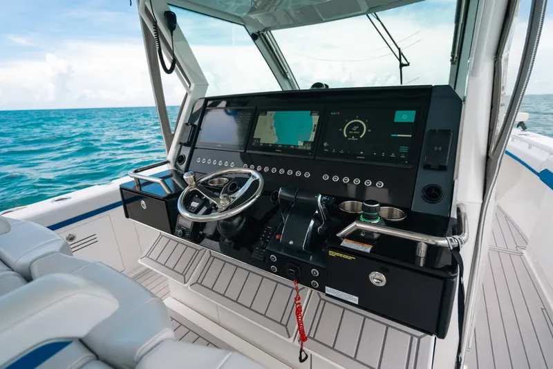 Slide: The Image of 2026 Formula 387 Center Console Fish boat dashboard with advanced navigation systems. - 52