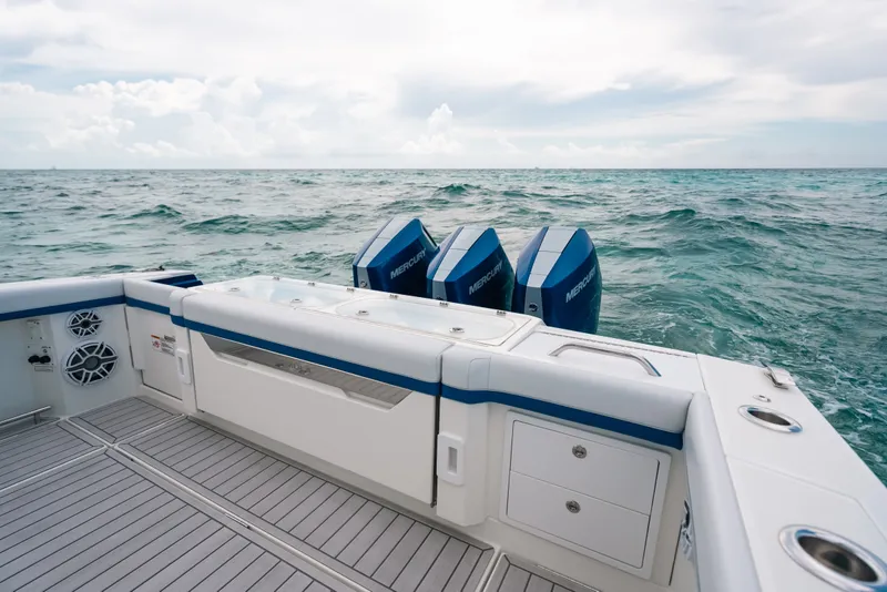 Slide: The Image of 2026 Formula 387 Center Console Fish boat with Mercury engines on open sea. - 24