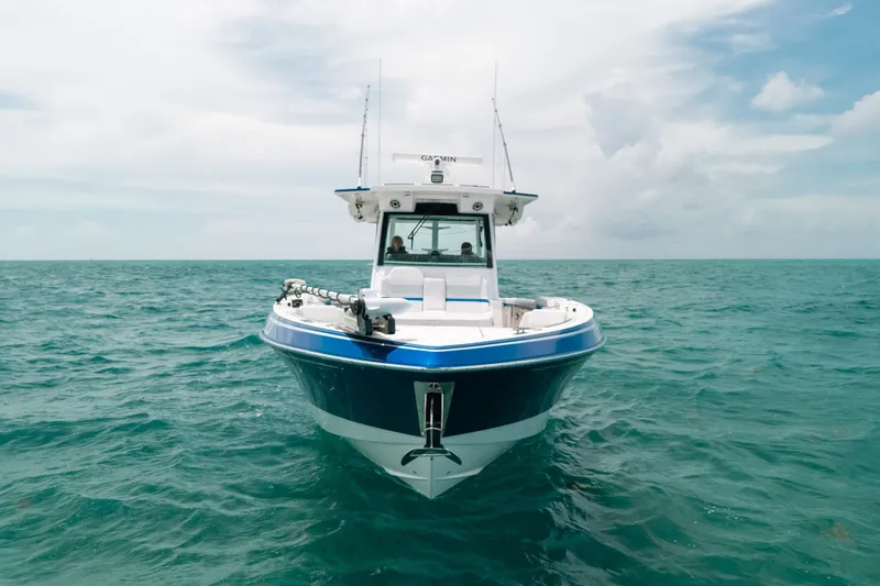 Slide: The Image of 2026 Formula 387 Center Console Fish boat on open sea under cloudy sky. - 18