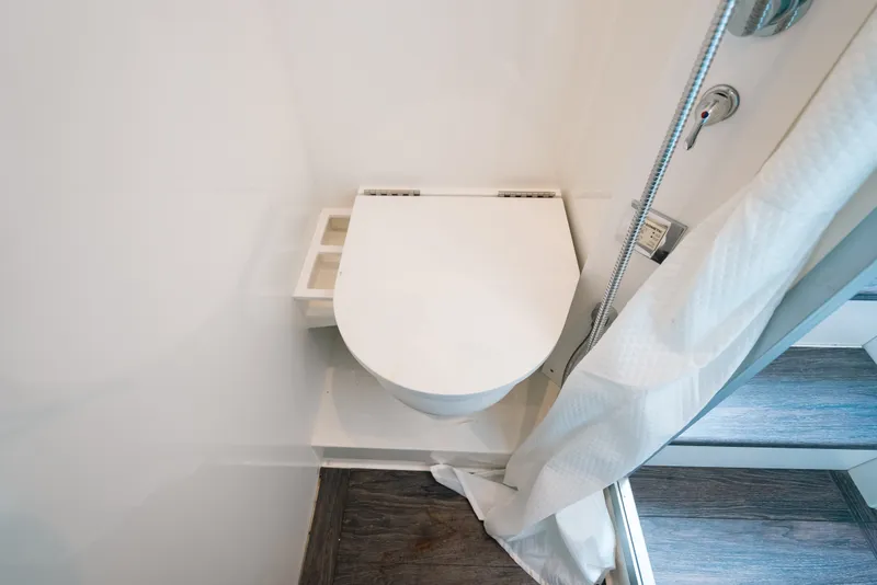 Slide: The Image of Modern bathroom in 2026 Formula 387 Center Console Fish boat, featuring sleek toilet design. - 73