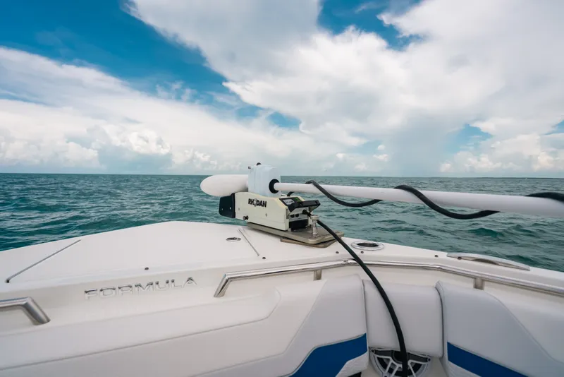 Slide: The Image of 2026 Formula 387 Center Console Fish boat on open sea under blue sky. - 60