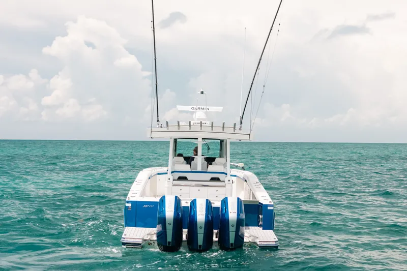 Slide: The Image of 2026 Formula 387 Center Console Fish boat on open sea with four engines. - 3