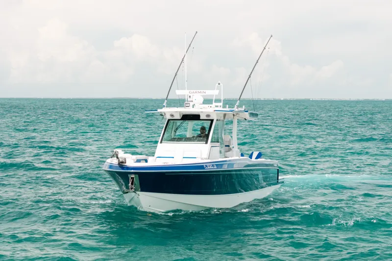 Slide: The Image of 2026 Formula 387 Center Console Fish boat navigating on open sea. - 6