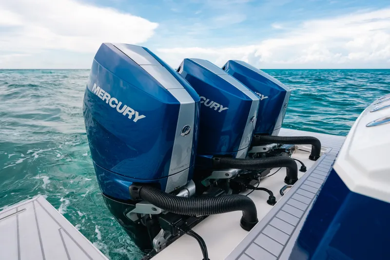 Slide: The Image of Triple Mercury outboard engines on 2026 Formula 387 Center Console Fish boat in ocean. - 27