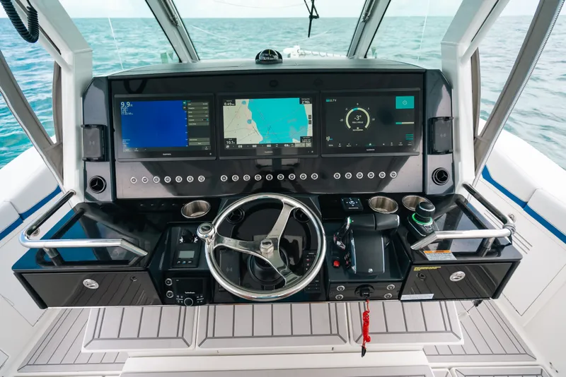 Slide: The Image of Helm of 2026 Formula 387 Center Console Fish with advanced navigation displays. - 55