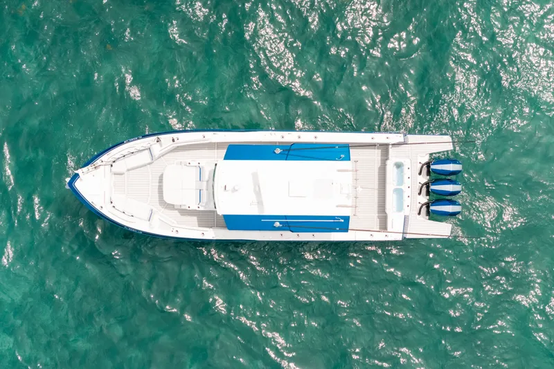 Slide: The Image of Aerial view of 2026 Formula 387 Center Console Fish boat on turquoise water. - 17