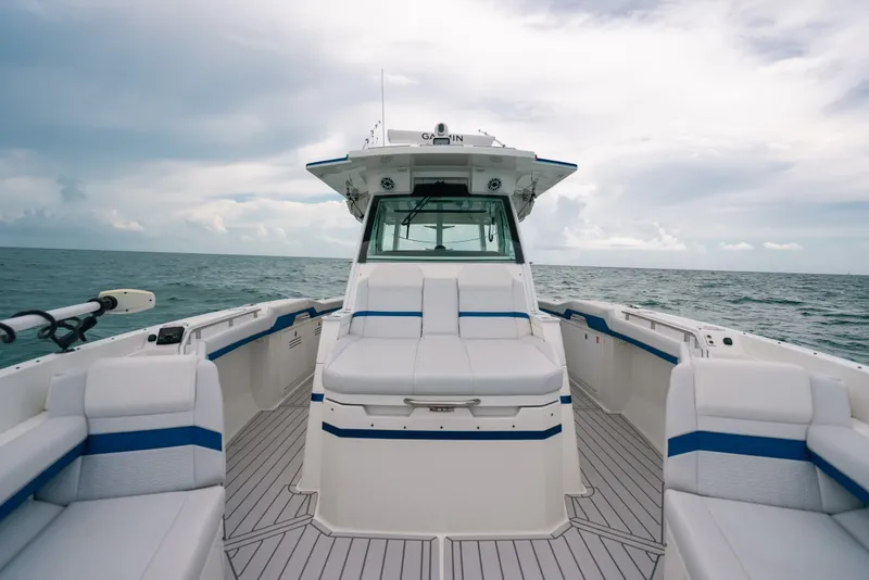 Slide: The Image of 2026 Formula 387 Center Console Fish boat on open water, showcasing sleek design and seating. - 62