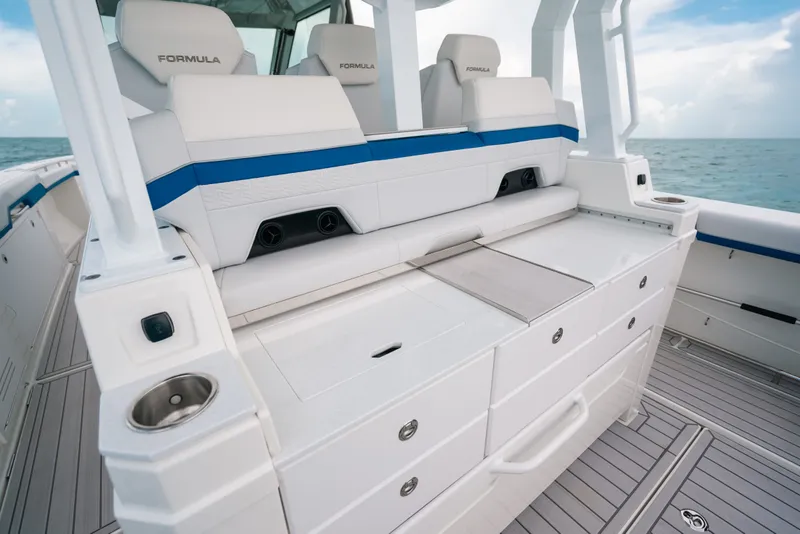 Slide: The Image of 2026 Formula 387 Center Console Fish boat interior with sleek seating and storage. - 43