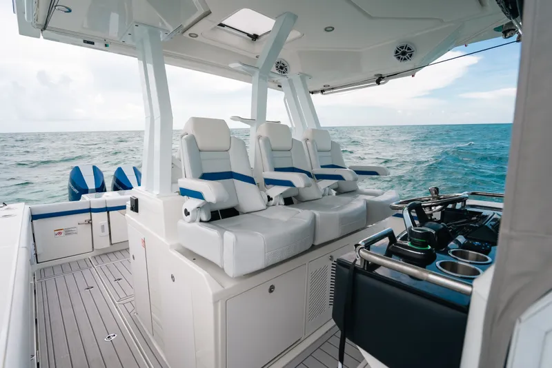 Slide: The Image of 2026 Formula 387 Center Console Fish boat interior with ocean view, featuring modern seating and controls. - 53