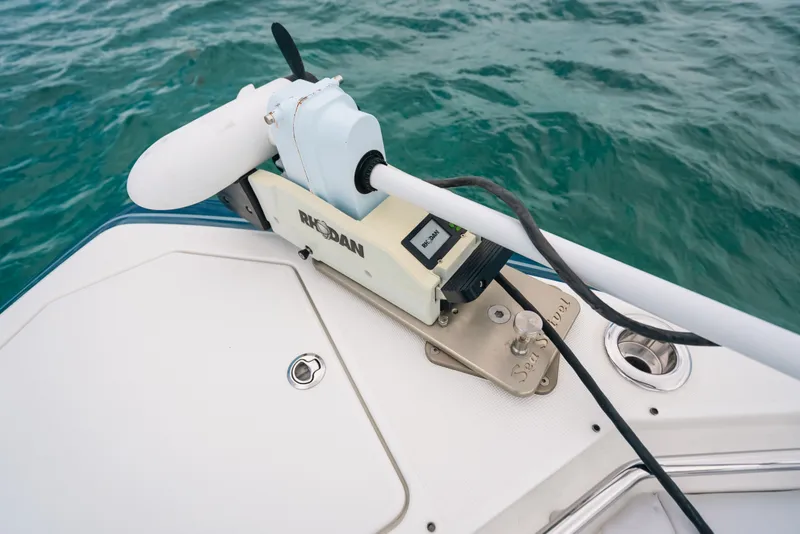 Slide: The Image of Trolling motor on 2026 Formula 387 Center Console Fish boat in clear waters. - 63