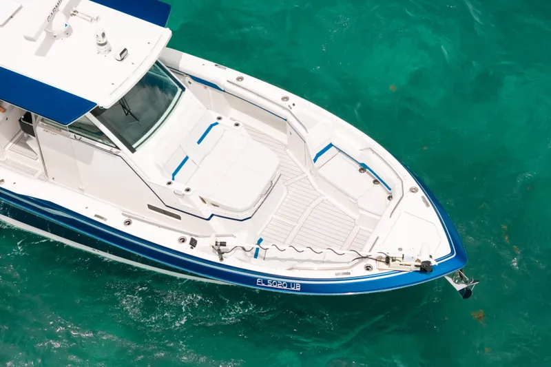 Slide: The Image of 2026 Formula 387 Center Console Fish boat on turquoise water, aerial view. - 8