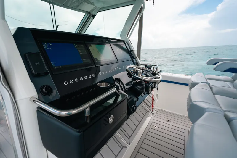 Slide: The Image of 2026 Formula 387 Center Console Fish boat dashboard with ocean view. - 56