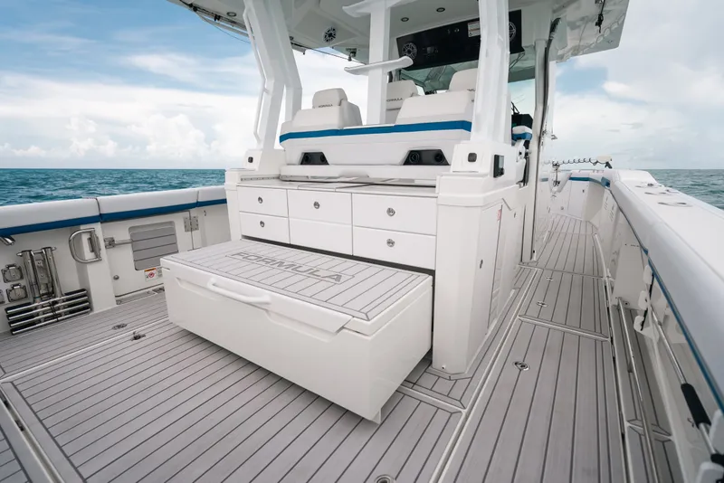 Slide: The Image of 2026 Formula 387 Center Console Fish boat with sleek deck and storage compartments. - 40