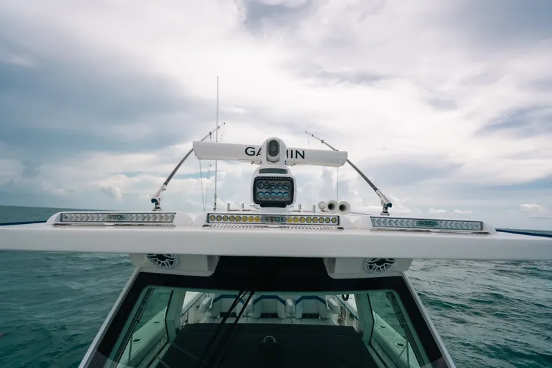 Slide: The Image of 2026 Formula 387 Center Console Fish boat on open water, showcasing advanced navigation equipment. - 61