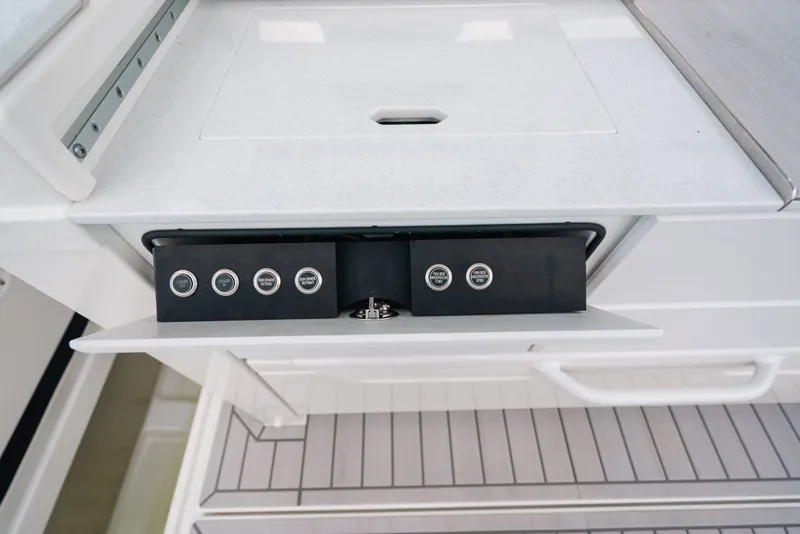 Slide: The Image of Control panel on 2026 Formula 387 Center Console Fish boat, featuring sleek design and modern buttons. - 45