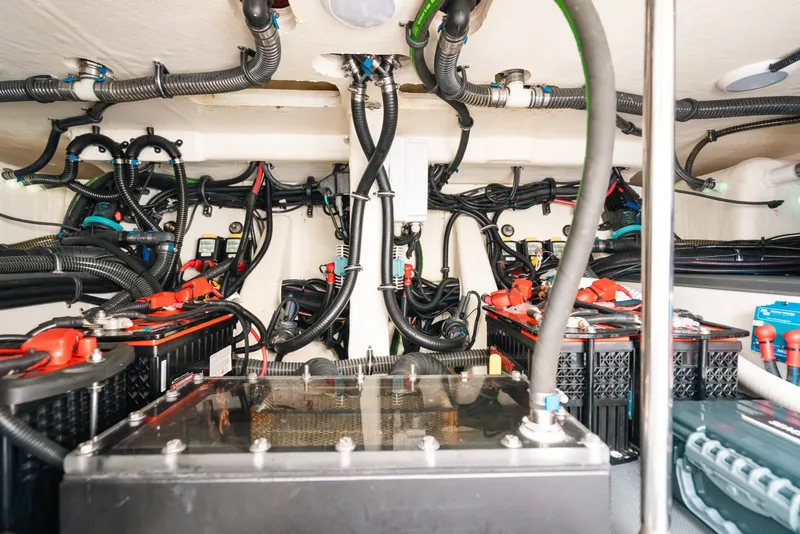 Slide: The Image of Engine compartment of 2026 Formula 387 Center Console Fish, showcasing wiring and battery systems. - 34