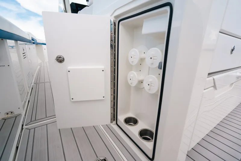 Slide: The Image of Open storage compartment on 2026 Formula 387 Center Console Fish boat deck. - 48