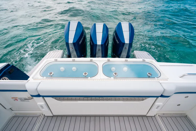 Slide: The Image of 2026 Formula 387 Center Console Fish boat with triple Mercury engines on the ocean. - 26