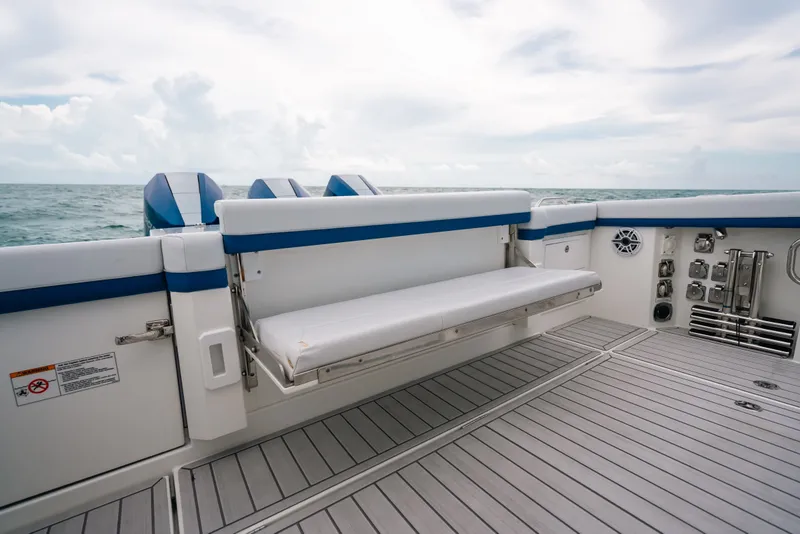 Slide: The Image of 2026 Formula 387 Center Console Fish boat with sleek seating and ocean backdrop. - 65