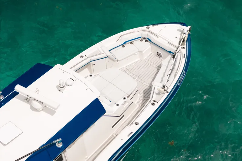 Slide: The Image of 2026 Formula 387 Center Console Fish boat on clear turquoise water. - 10