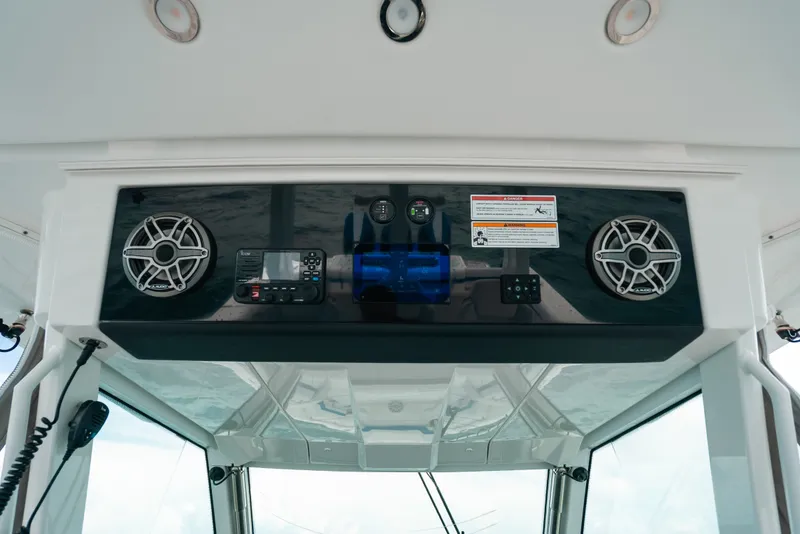 Slide: The Image of 2026 Formula 387 Center Console Fish dashboard with speakers and control panel. - 57