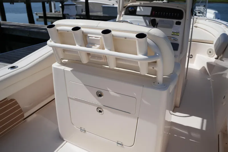 Slide: The Image of 2017 Grady-White Fisherman 236 boat interior with rod holders and storage compartments. - 15