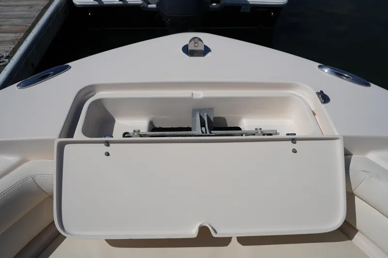 Slide: The Image of 2017 Grady-White Fisherman 236 boat anchor storage compartment open at dock. - 30