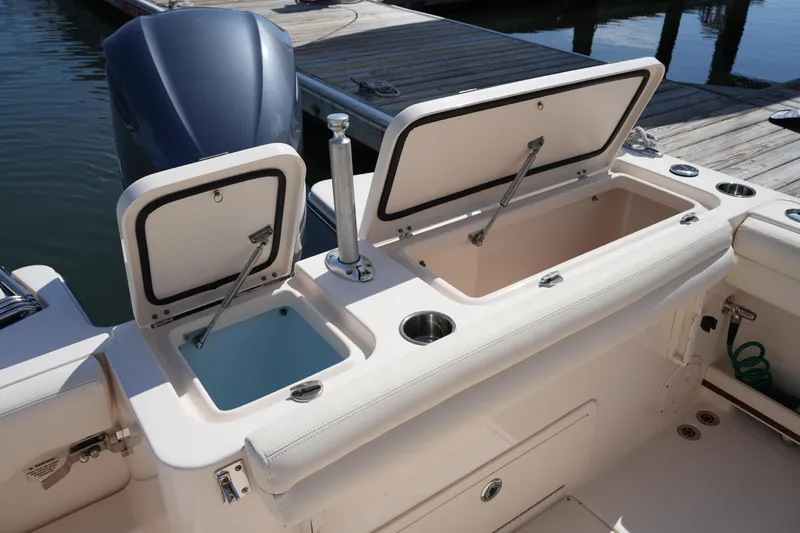 Slide: The Image of 2017 Grady-White Fisherman 236 boat with open storage compartments at the dock. - 14
