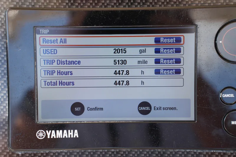 Slide: The Image of Yamaha display showing trip data: 2015 gallons used, 5130 miles, 447.8 hours on Grady-White Fisherman 236. - 24