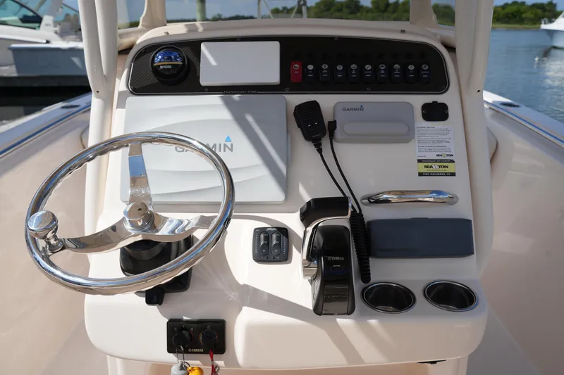 Slide: The Image of 2017 Grady-White Fisherman 236 helm with Garmin navigation and Yamaha controls. - 19