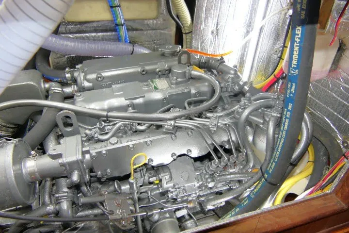 Slide: The Image of Engine compartment of a 2001 Hunter 420 sailboat, showcasing detailed mechanical components. - 93