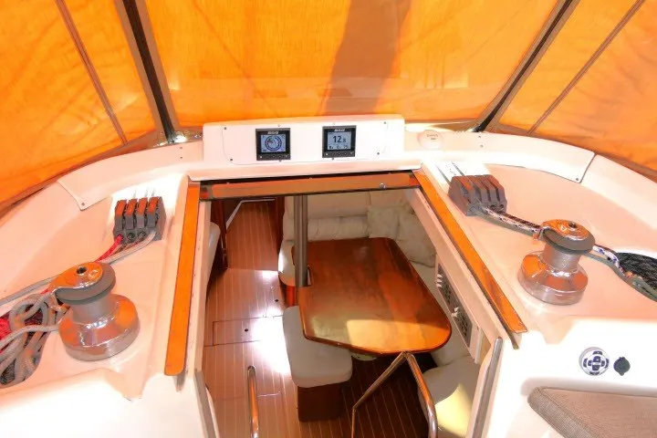Slide: The Image of Interior view of 2001 Hunter 420 sailboat with wooden table and seating area. - 44
