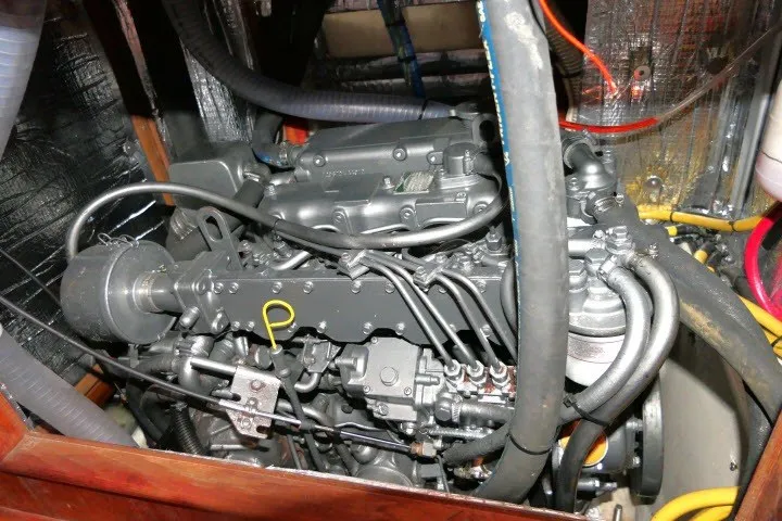Slide: The Image of Engine compartment of a 2001 Hunter 420 sailboat, showcasing detailed mechanical components. - 92