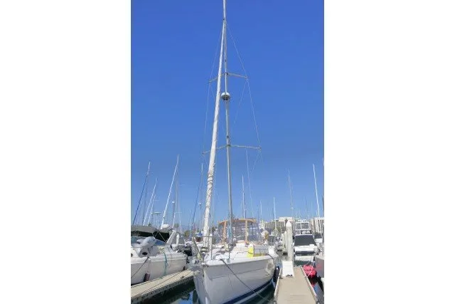 Slide: The Image of Sailboat docked at marina, Hunter 420 model, 2001, under clear blue sky. - 98