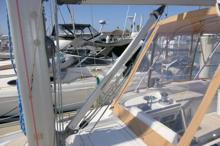 Slide: The Image of 2001 Hunter 420 sailboat in marina, showcasing cockpit and rigging details. - 66