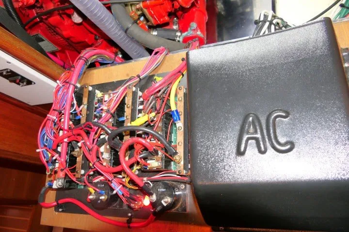 Slide: The Image of Electrical wiring and AC box inside a 2001 Hunter 420 boat. - 87