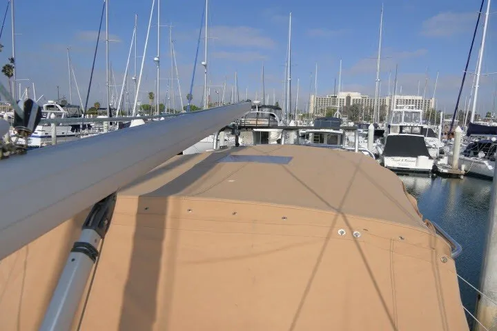 Slide: The Image of Sailboat Hunter 420 (2001) docked in a marina with clear skies. - 67