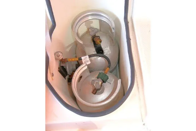 Slide: The Image of Propane tanks in storage compartment of 2001 Hunter 420 boat. - 76