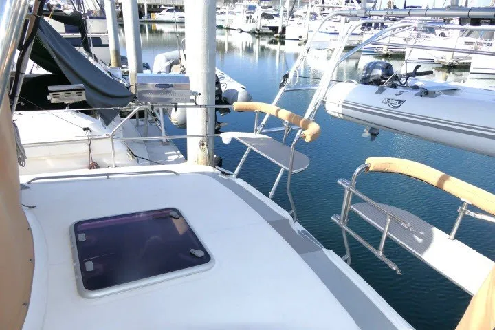 Slide: The Image of Hunter 420 sailboat deck, 2001 model, docked at marina with inflatable dinghy. - 54
